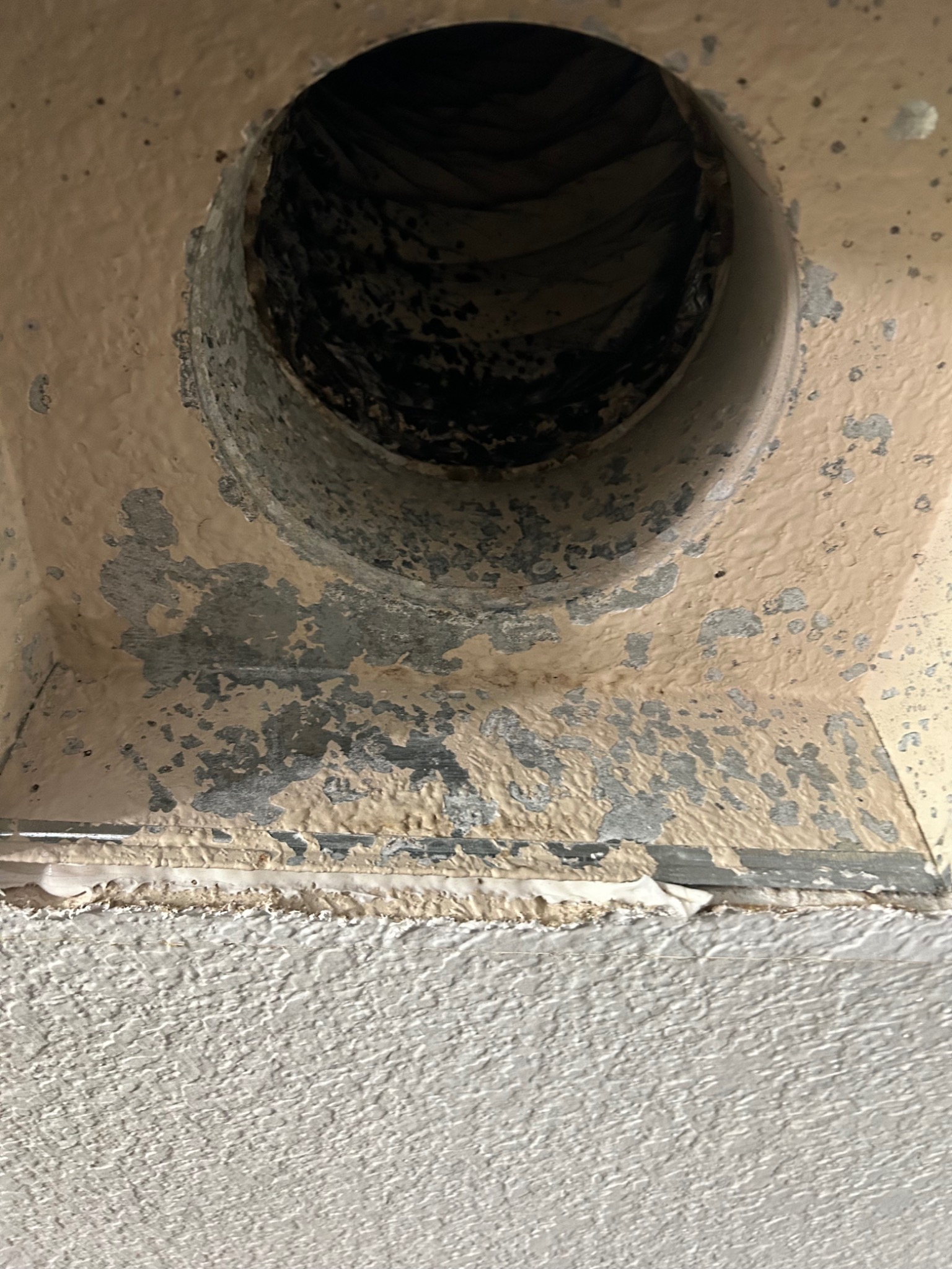 Dust accumulation inside duct opening before cleaning