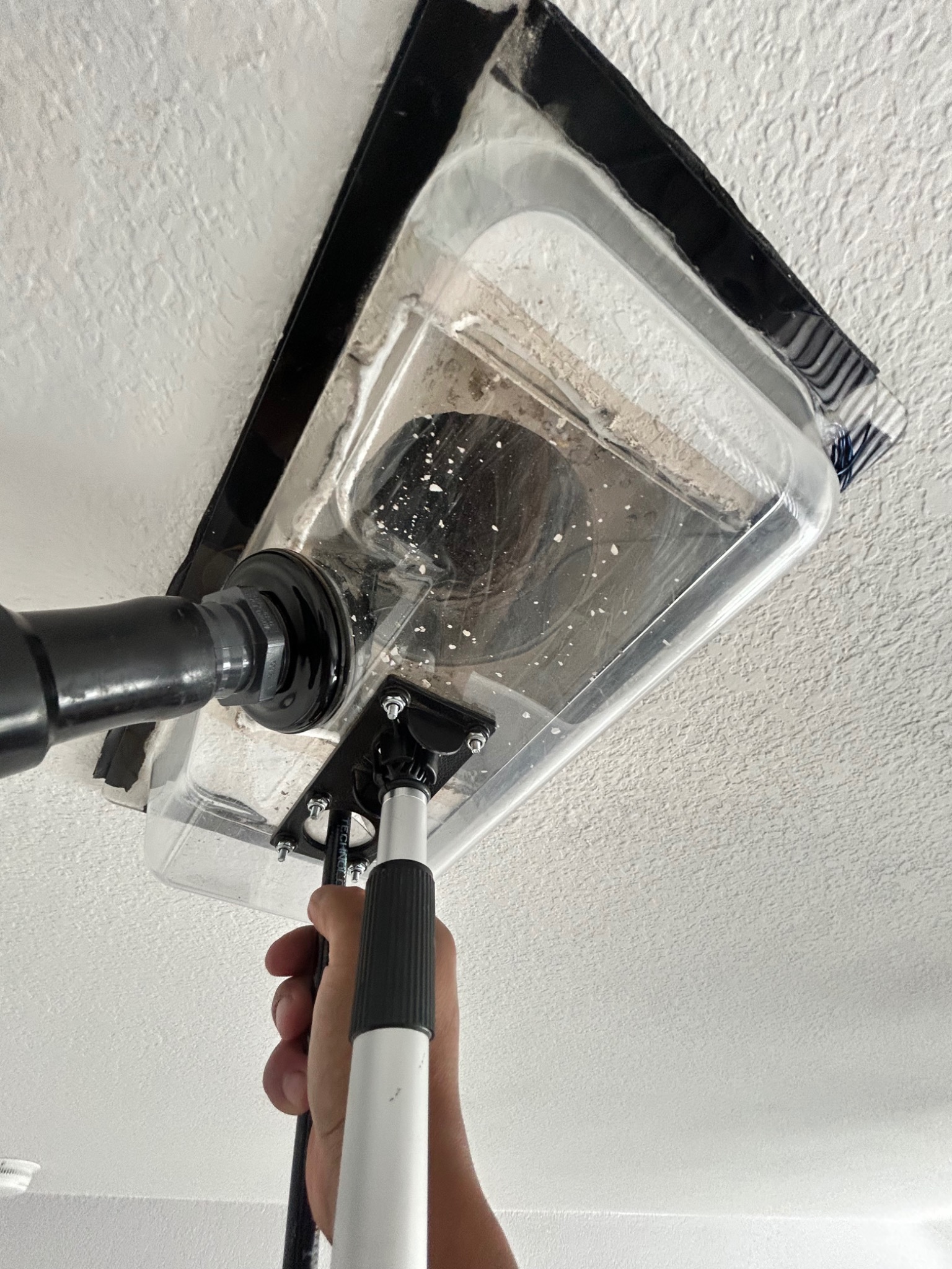 Professional duct-cleaning vacuum equipment in use